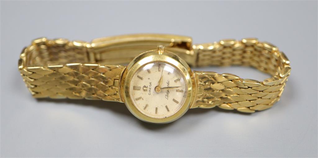 A ladys 1960s Omega Ladymatic wrist watch, on an 18ct gold bracelet with expanding clasp,